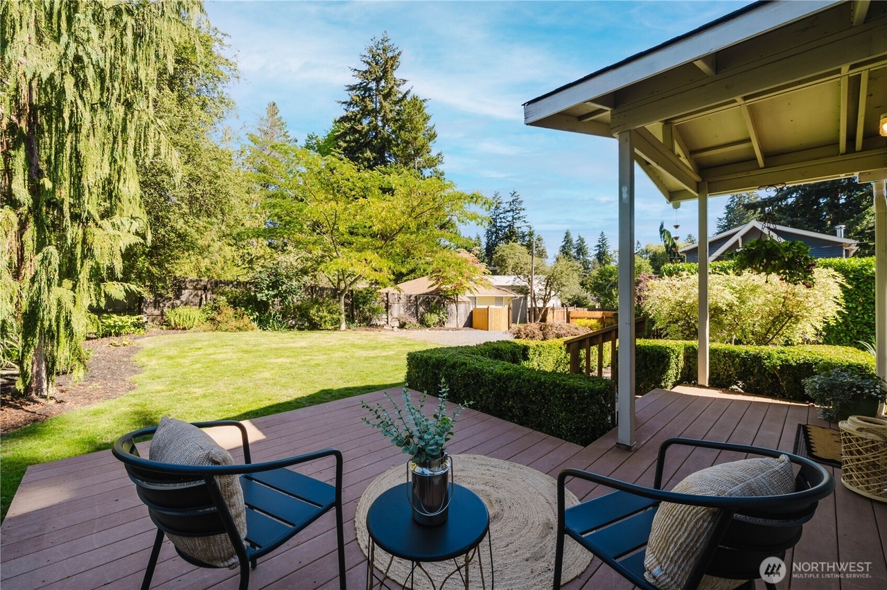 Covered outdoor seating overlooking the landscaped grounds