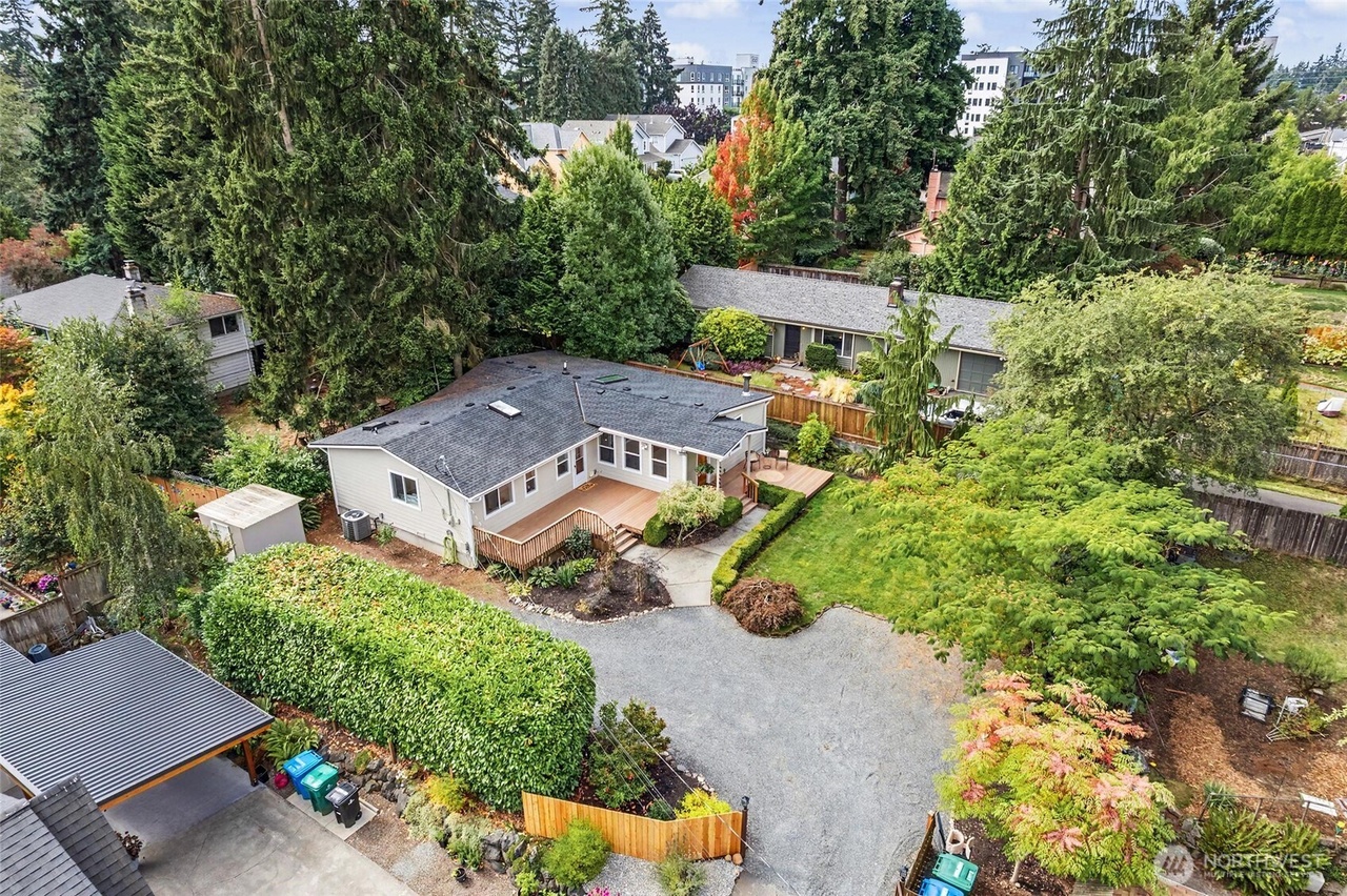 Aerial view of the home and its private landscaped setting