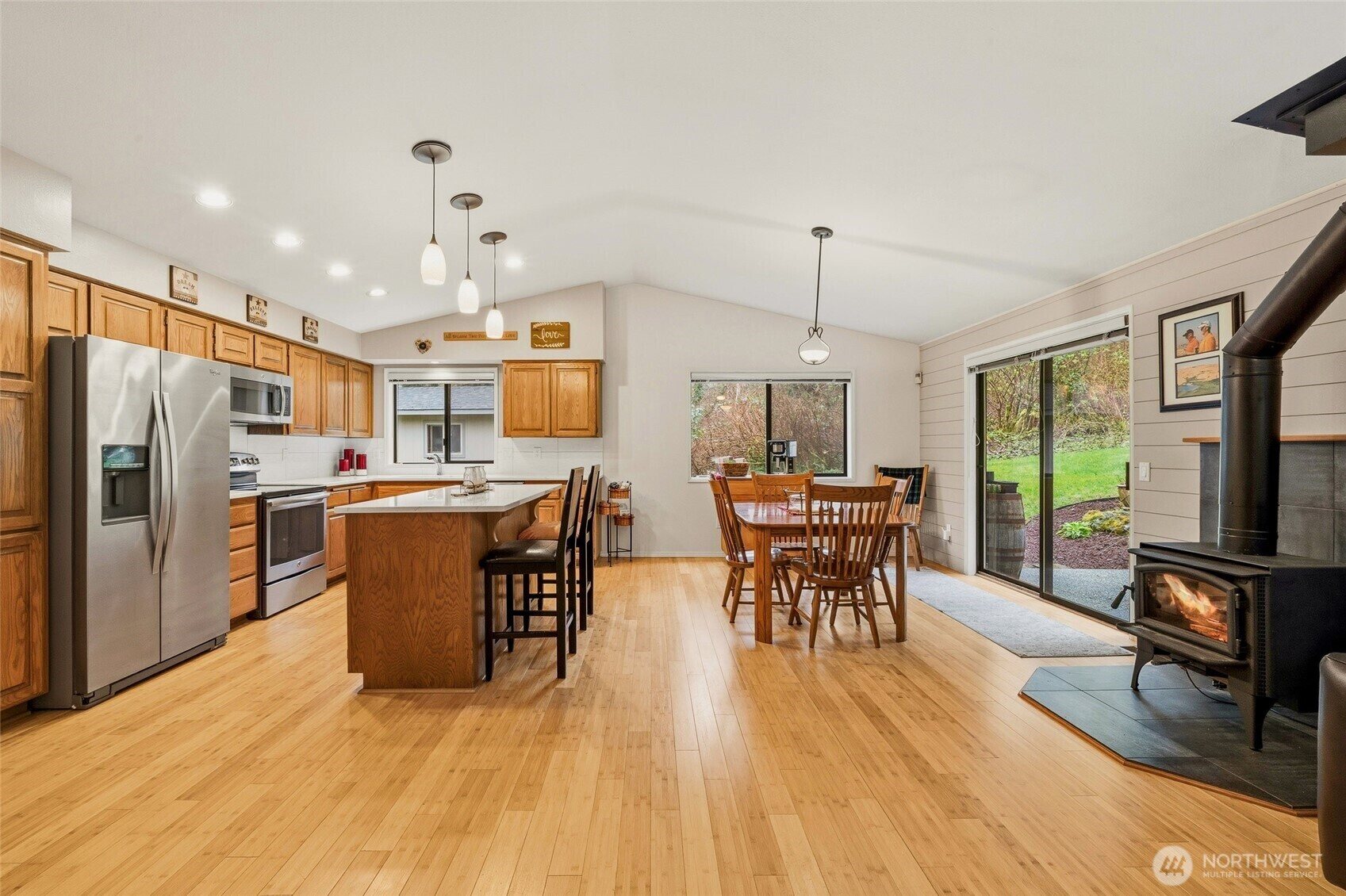Open kitchen, dining and living spaces