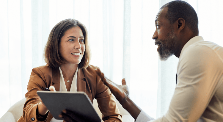 A real estate professional discussing the market with a client