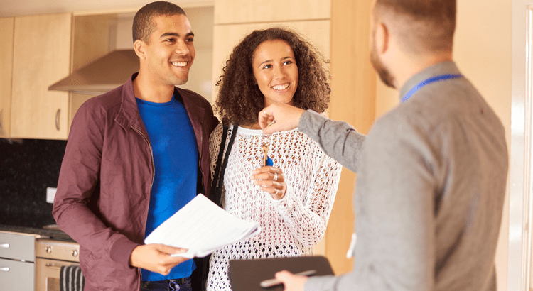 A couple touring a home with a real estate professional